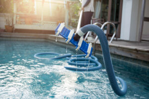 cleaning a pool with a vacuum